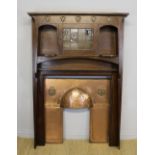 A fine Edwardian oak fire surround of Arts & Crafts design by Waring and Gillow, of angled shape,