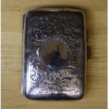 A George V silver cigarette case, with engraved curved body, 8cm x 5cm, Birmingham 1914, weight 42g