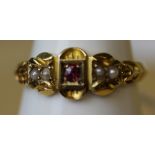 A Victorian 15ct gold ruby and seed pearl ring, ring size M