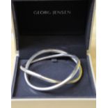 A Georg Jensen 'Alliance' bangle, of entwined circular form by Alan Sherff, marked 925s, 8cm