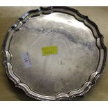 A modern silver salver, with raised 'pie crust' edge and four whorl type feet, marks for J.B