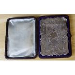 A Victorian silver card case, with shaped and engraved body, 10cm x 7.5cm, Birmingham 1870, weight