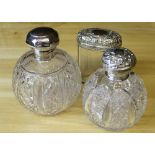 Two silver mounted and cut glass spherical scent bottles, Chester 1895 and Birmingham 1911