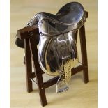 An Italian silver model of a saddle by Sachetti, on mahogany stand, 10cm high, stamped .925