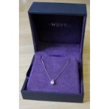 An 18ct white gold diamond pendant and chain by Wave, the diamond approx 0.2ct, with box for same