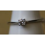 An 18ct white gold solitaire diamond ring, the diamond approx 0.10ct, ring size N, gross weight