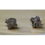 A pair of 18k and diamond cluster earrings, set with small diamond brilliants and baguettes 0.