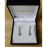 A pair of 18ct white gold, diamond and aquamarine pendant earrings, having four diamond baguette set