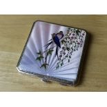 A George V silver compact of Art Deco design, the lid guilloche enamelled with a pair of birds on