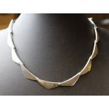 A Georg Jensen 'Peak' 925s necklace, comprised of triangular links designed by Bent Gabrielsen