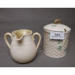 Two Pieces of Belleek a Clover Leaf Lidded Jam Pot and a Two Way Pouring Cream Jug both with green