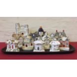 Twelve Staffordshire cottages pastel burners. Condition report: see terms and conditions