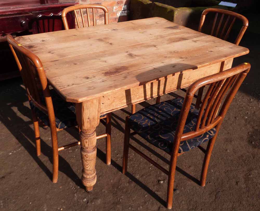 Pine kitchen table and four chairs. Condition report: see terms and conditions