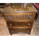 Reproduction oak Jacobean style three drawer chest on bracket feet. Condition report: see terms