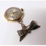 Lady's 18ct gold fob watch, circa 1910, on silver gilt bow brooch Condition report: see terms and