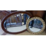 oval mahogany wall mirror and cream/gilt ditto by Peerart Productions Condition report: see terms