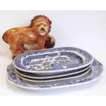 Four blue transfer meat plates together with a Staffordshire lion Condition report: see terms and