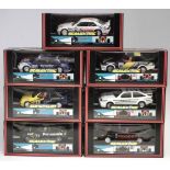 Seven Scalextric boxed cars with lights and Magnatraction, to include a Police car with siren and