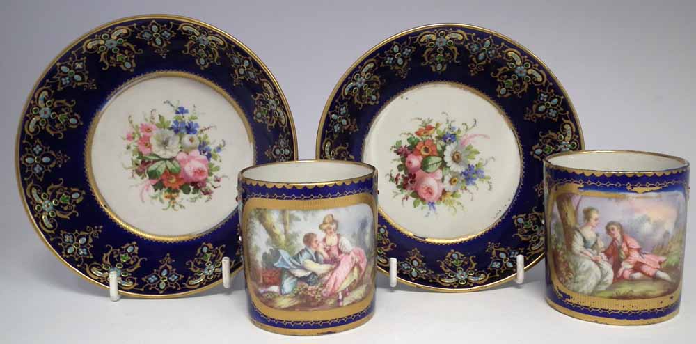 Two Sevres coffee cans and saucers, painted with floral sprays and figures within landscapes,