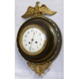 French patinated and gilt brass wall clock, the circular case with a cast egg and dart bezel,