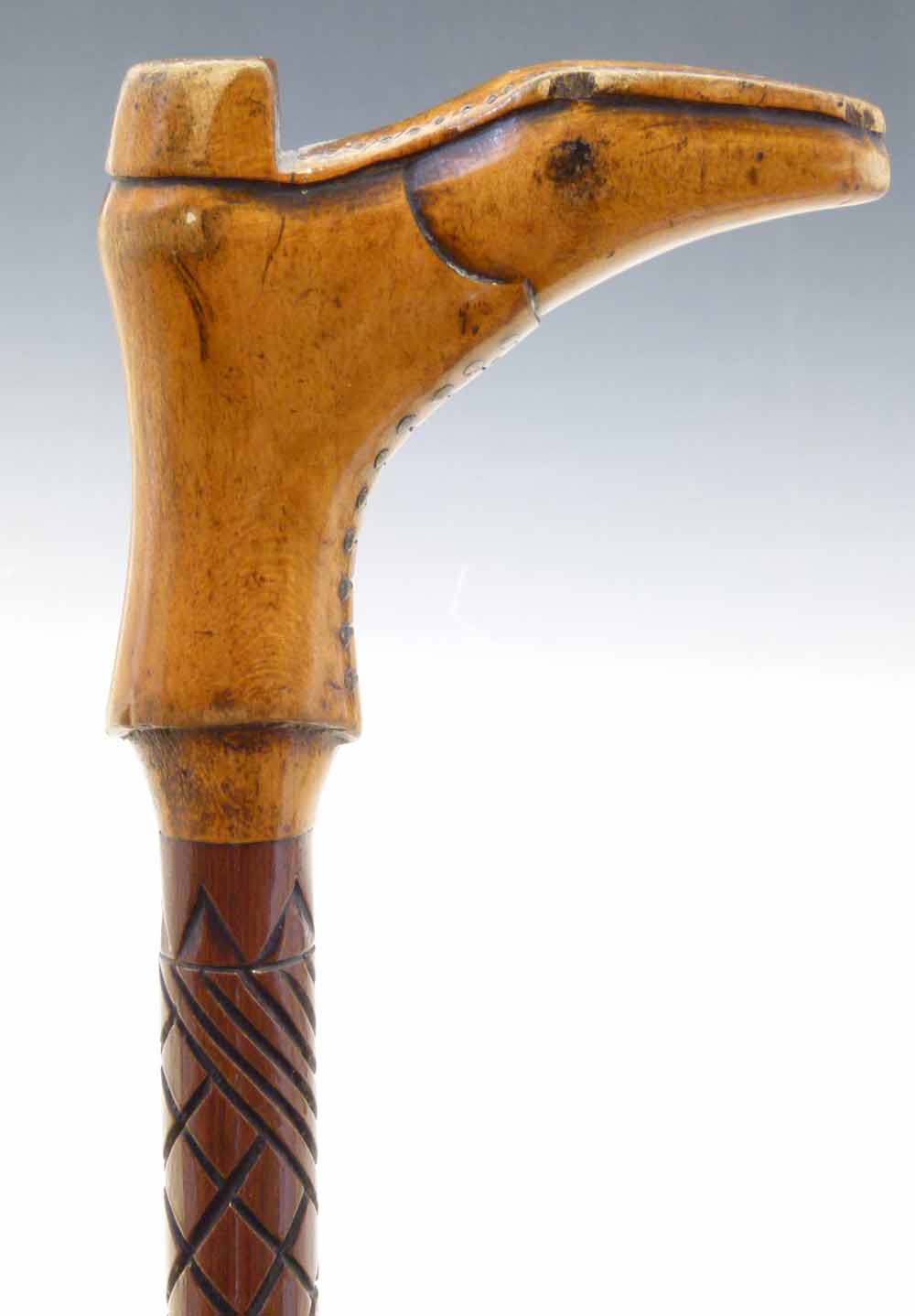 Hardwood walking cane, the handle in form of boot, length 93cm.