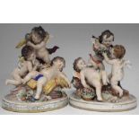 Pair of Crown Naples figure groups, each modelled with three cherubs, printed marks to base, (2)