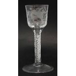 Wine glass circa 1770, with engraved bowl decorated with flowers and exotic birds supported on