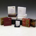 Thirteen proof silver five pounds (£5) coins in presentation boxes.