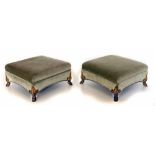 A pair of early 19th century regency style footstools, each with upholstered square frame and