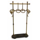 Edwardian Arts & Crafts design brass umbrella stand, unusually fitted with four retaining rings,