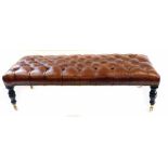 Victorian deep buttoned upholstered foot stool, covered in brown leather, all supported on four