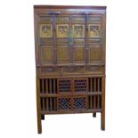 Early 20th century Chinese hardwood cupboard, top section with panel doors and three drawers above