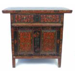 Early 20th century Chinese red lacquered side cabinet, two frieze drawers above two single panel