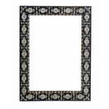Indian hardwood wall mirror, the frame inset with shell and wire in a floral design, 82 x 61cm