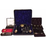 Two cased sets of silver spoons, christening set, commemorative spoon, and a caed table set