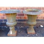 Pair of cast iron garden urns Condition report: see terms and conditions