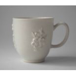 Chelsea blanc de chine cup circa 1750, moulded with prunus, 5.5cm high Condition report: No damage