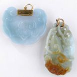 Two Chinese jade pendants with yellow metal suspensions, one carved with a bat on a pear, length