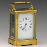 French brass carriage clock, white enamel Roman dial, repeating movement striking the half on a coil