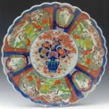 Japanese Imari foliated charger painted in enamels with a central vase of flowers surrounded by