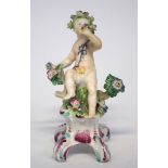 Bow figure of a cherub circa 1750, modelled sat on a scrolled base, 13.5cm high Condition report: