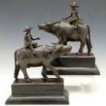 Pair of patinated bronze studies both of a Siamese coolie on the back of a water buffalo, length