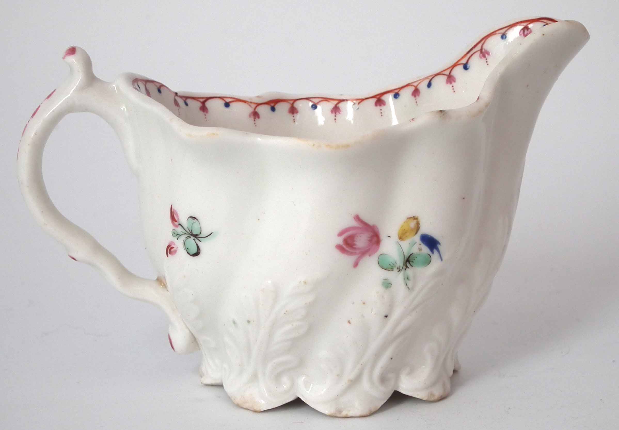 Caughley Low Chelsea Ewer circa 1790, painted with flora and moulded with acanthus leaves, 11cm wide - Image 3 of 6