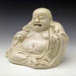 Chinese white glazed Fukian figure of the sitting Budai, width 21cm, Qing dynasty