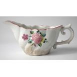 Baddeley-Littler creamboat circa 1780-85, with moulded scroll handle, painted with flora,13cm long