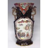 Large Mason's Ironstone vase, with twin dragon handles, decorated with a Chinoiserie landscape