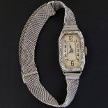 Swiss cocktail bracelet watch, rectangular silvered dial, diamond set bezel, case stamped "platinum"