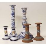 Two Delft candlesticks, pair of Doulton silicon Lambeth candlesticks and another pair of