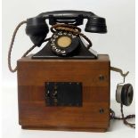 Bakalite telephone on wooden base c/w separate earphone Condition report: see terms and conditions