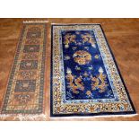 Chinese silk carpet, 215 x 121cm and one other runner. Condition report: see terms and conditions